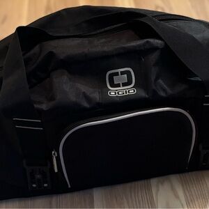 OGIO Black Duffel Bag with Shoe holder built into end.